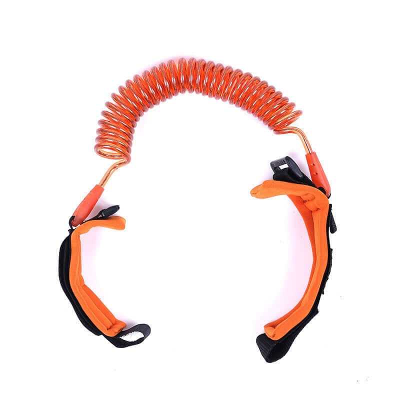 Child safety wristband with coiled leash and adjustable straps for secure attachment to kids.