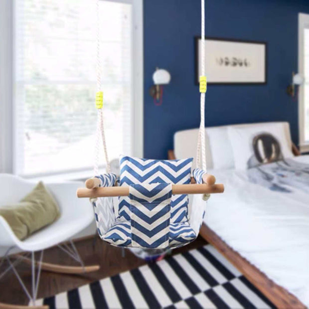 Toddler swing chair in a stylish bedroom, designed for safe indoor swinging for children 6 months to 3 years.